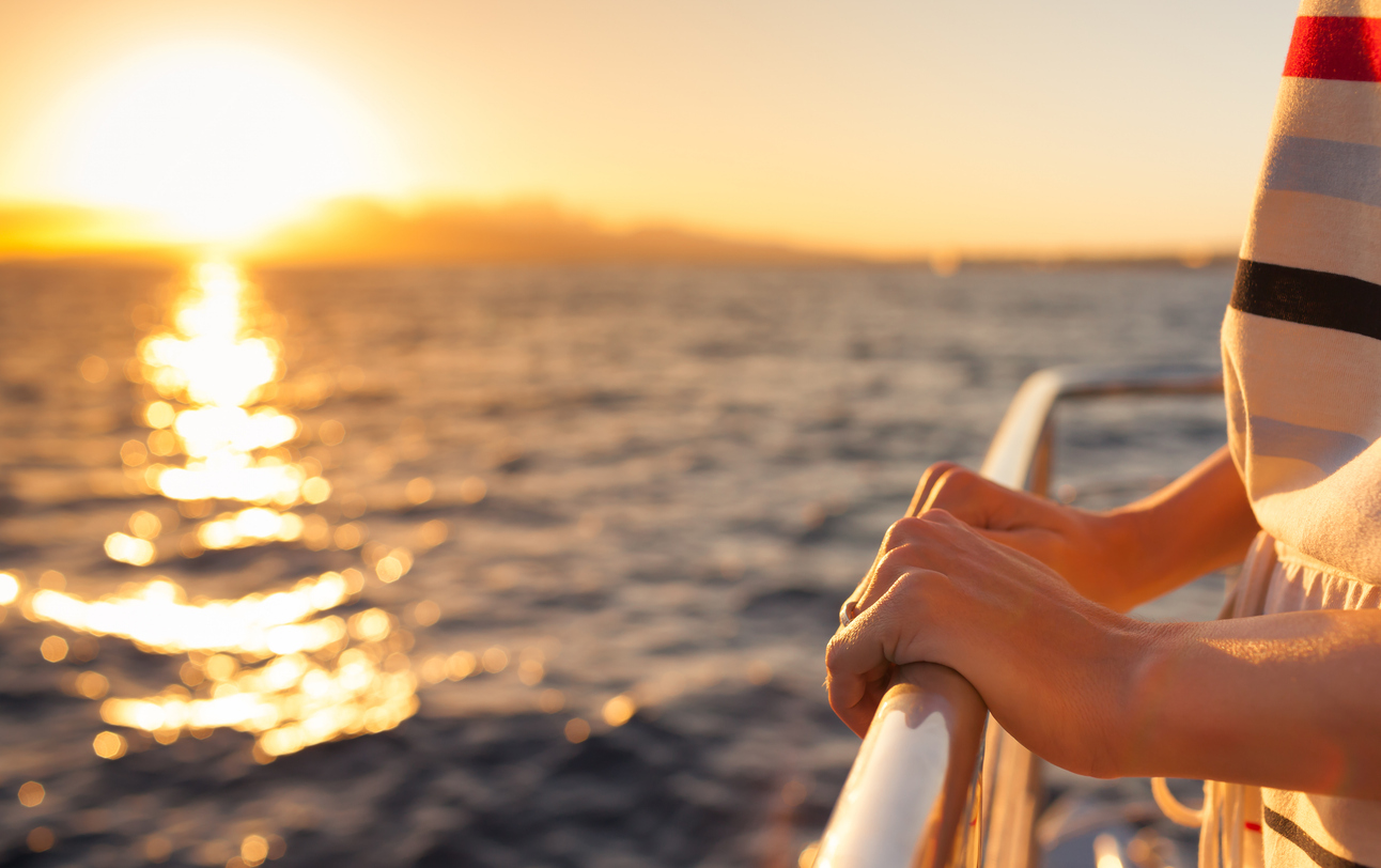 Sunset over the water from the deck of a charter boat